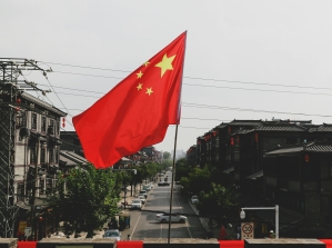 Chinese flag in front of neighborhood