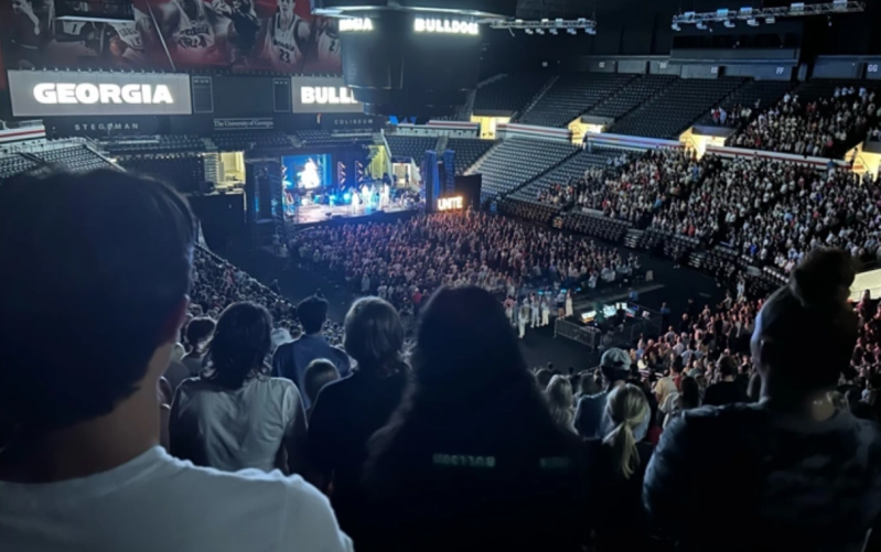 Students from the University of Georgia gather at nearby Stegeman Coliseum 