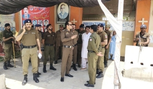 Police guard Presbyterian church building in Sargodha, Pakistan on Sunday (May 26, 2024). 