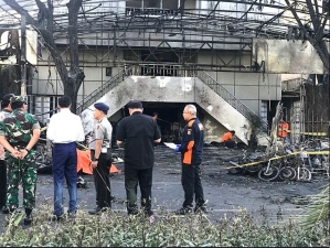 Indonesian President Joko Widodo (in white) at one of the church buildings attacked by terrorists in May 2018. 