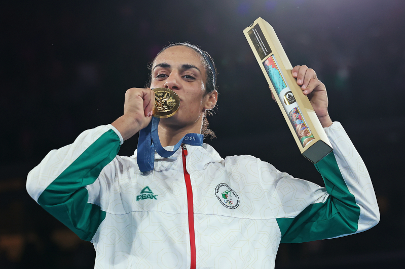 Gold Medallist Imane Khelif of Team Algeria kisses her medal during the Boxing Women's 66kg medal ceremony after the Boxing Women's 66kg Final match on day fourteen of the Olympic Games Paris 2024