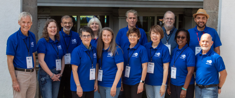 John Maust (far left) stepped back from MAI after 26 years and handed over the association's leadership to Heather Pubols (6th from the left).